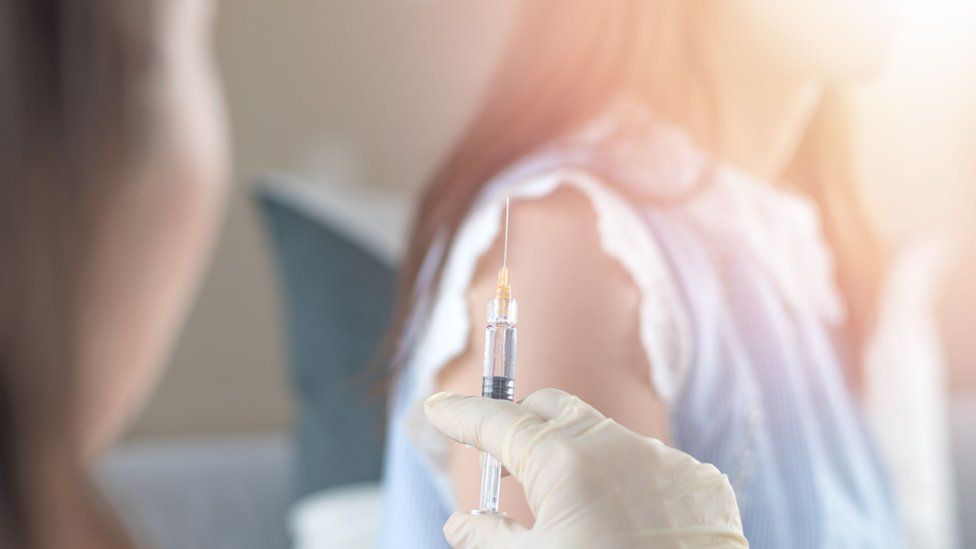 Girl being given a vaccination