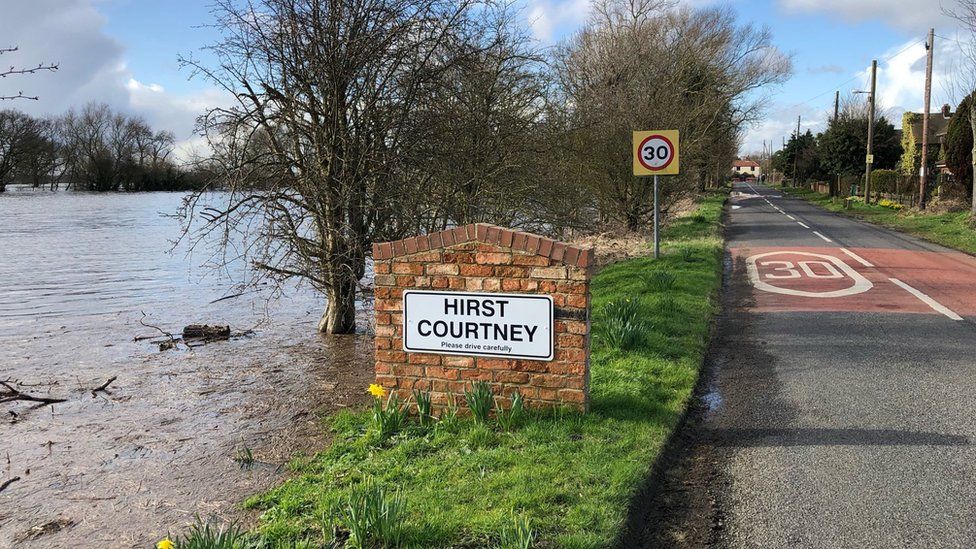 A sign on the way into Hirst Courtney