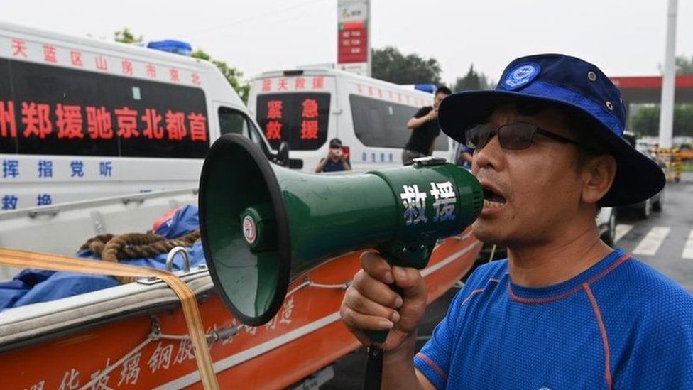 Rescuers pictured in Henan province