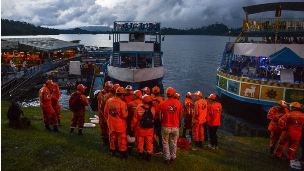 Rescue officials gather to take part in a search for survivors