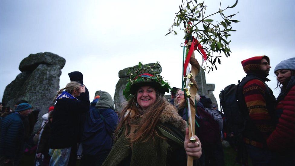 Woman celebrating the winter solstice at Stonehenge