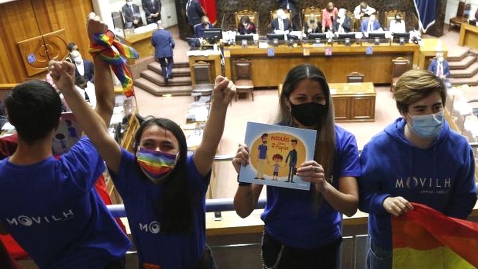 Members of different social movements celebrate in the Senate after the passing of a bill to legalise same-sex marriage in Chile, at the National Congress in Valparaiso, Chile, 7 December 2021