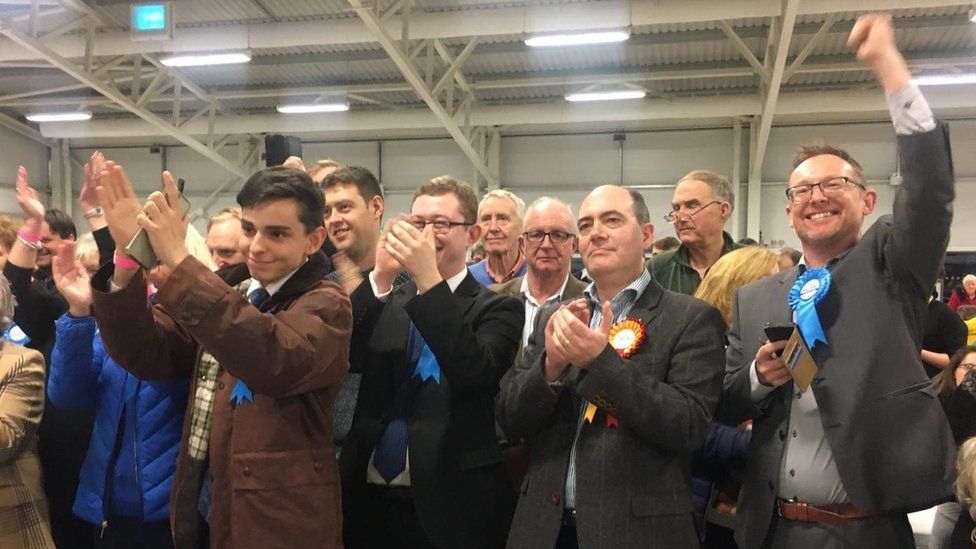 Conservative supporters celebrate victories at the count in Builth Wells