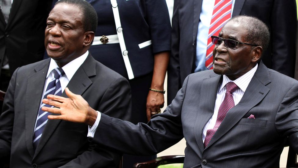 Emmerson Mnangagwa (L) and Robert Mugabe (R) pictured in 2014