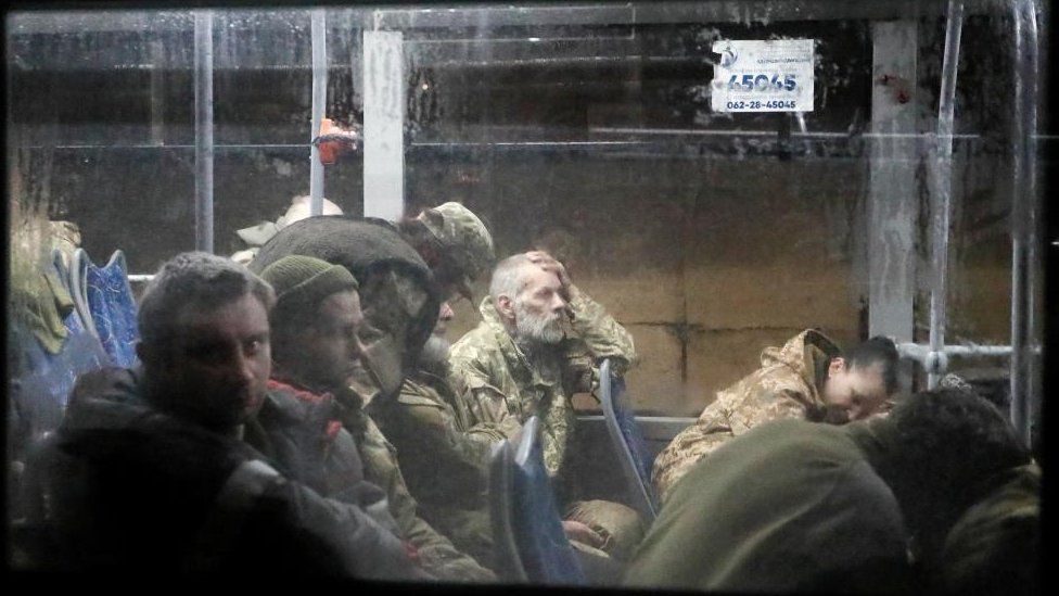 Service members of the Ukrainian armed forces, who surrendered at the besieged Azovstal steel mill in Mariupol in the course of Ukraine-Russia conflict, sit in a bus upon their arrival under escort of the pro-Russian military in the settlement of Olenivka in the Donetsk region, Ukraine May 20, 2022.
