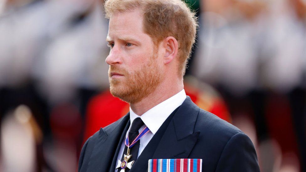 Prince Harry, Duke of Sussex walks behind Queen Elizabeth II's coffin as it is transported on a gun carriage from Buckingham Palace to The Palace of Westminster ahead of her Lying-in-State on September 14, 2022 in London, United Kingdom.
