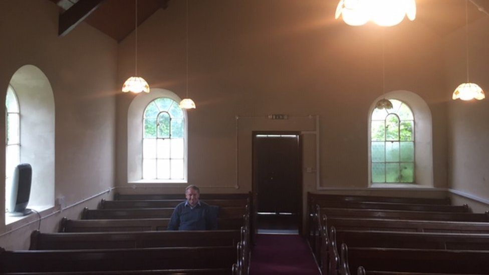 Eirian Jones sitting in the chapel