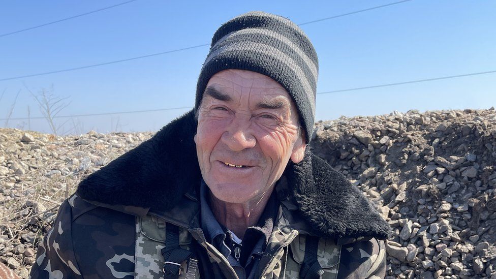 Picture showing 62-year-old Sergei who has taken up arms