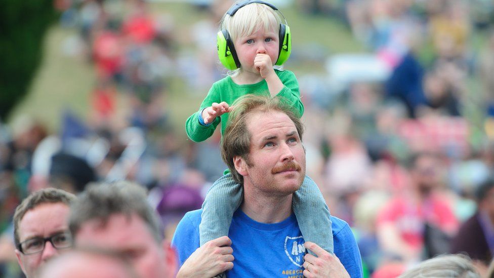 Peter Mackay-Lewis and his son Leo aged 2 at the Green Man Festival, Crickhowell.
