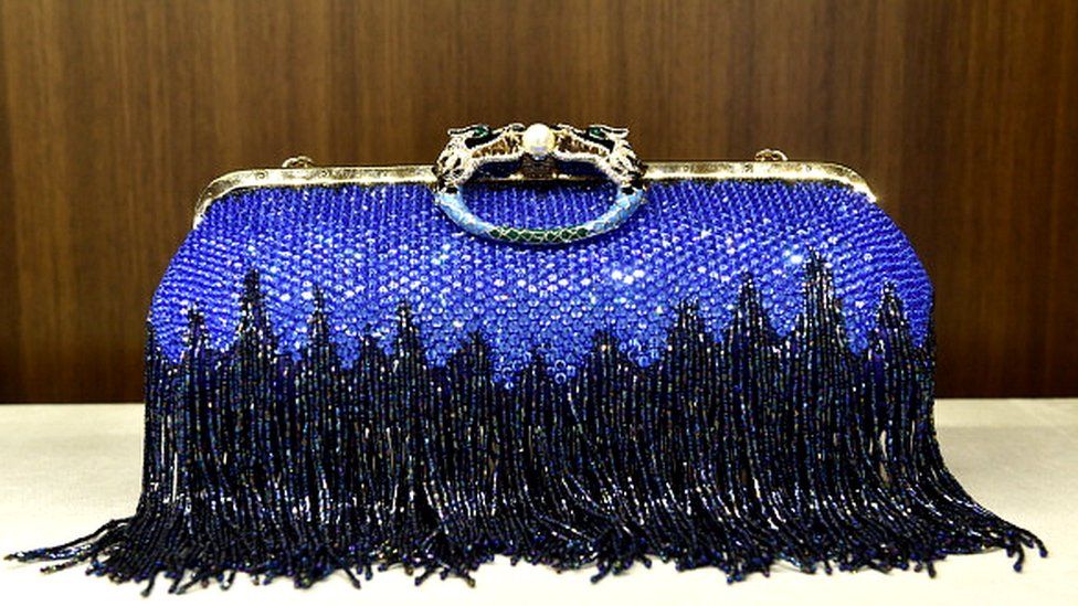 Tom Ford helped bring high-end accessories into the mainstream - this Gucci clutch bag was auctioned in 2014