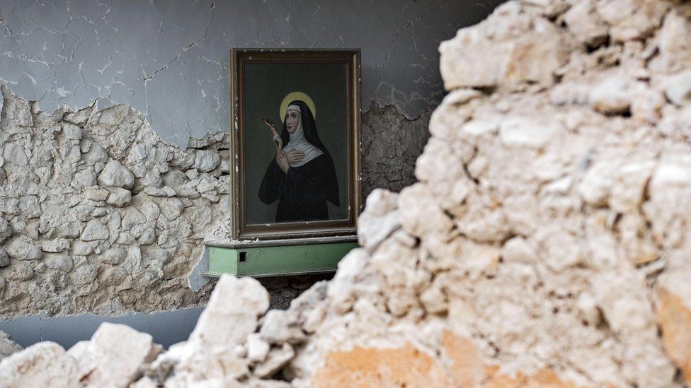 A painting sketches Santa Rita da Cascia inside S. Maria della Cona church devastated by a quake in Frascaro, Umbria region, Italy, 2 November 2016.