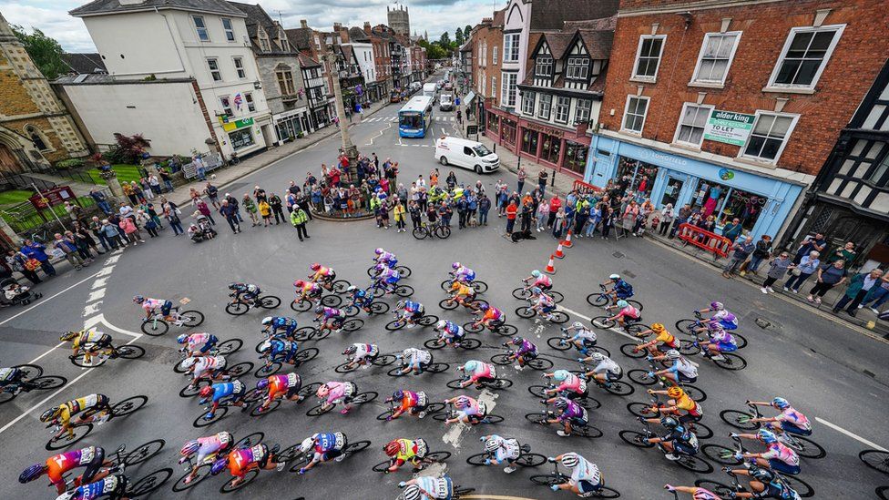 The Peloton rides through Tewkesbury, Gloucestershire during stage three of The Women's Tour from Tewkesbury to Gloucester.