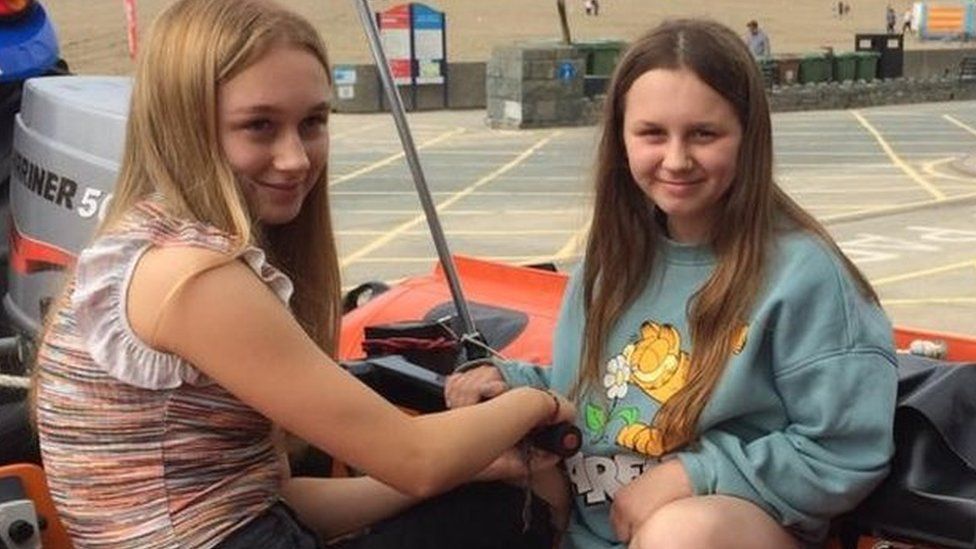 Elsie and Mabel in a lifeboat