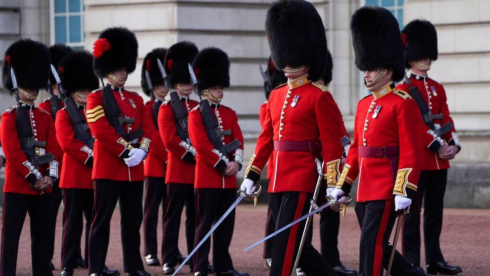 Soldiers from the 1st Battalion Coldstream Guards take part in the Changing of the Guard in the forecourt of Buckingham Palace