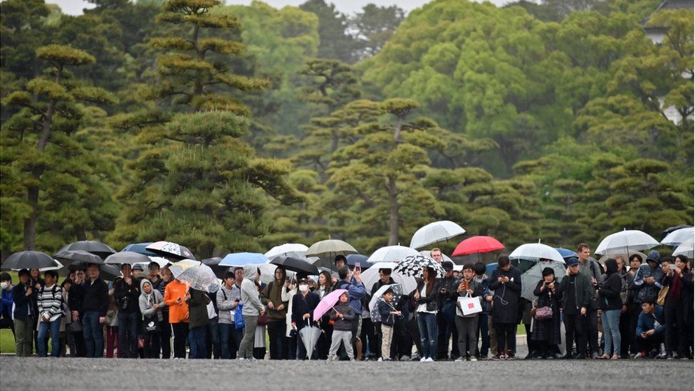 People outside the Imperial Palace in Tokyo