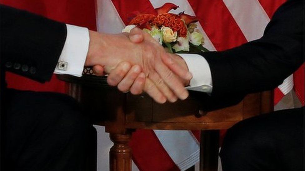 The Trump-Macron handshake