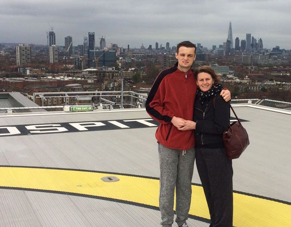 Will with his mother on top of the London hospital where he was treated