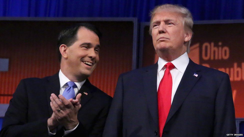 Scott Walker and Donald Trump stand on the stage at the Republican debate in Ohio.