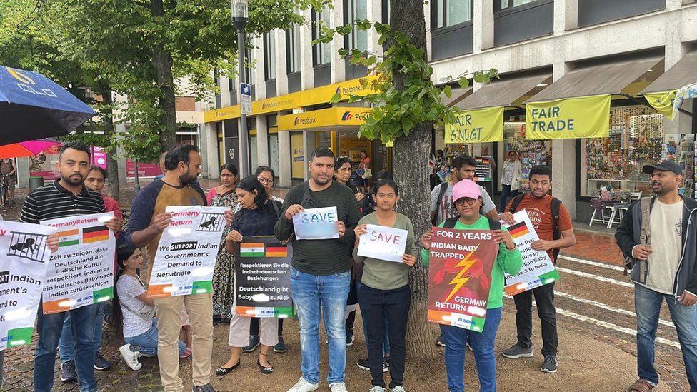 Protesters in the German city of Darmstadt in support of the repatriation of the Indian child