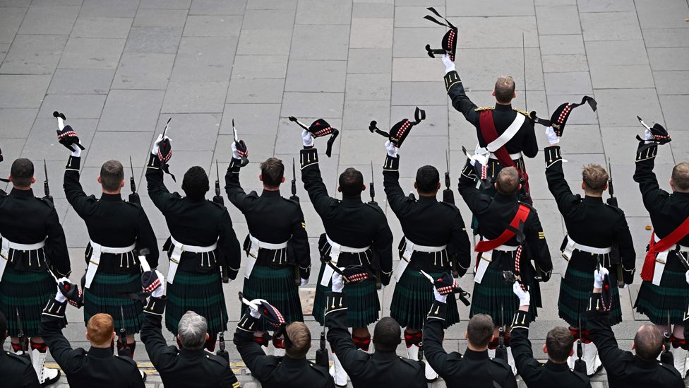 Members of the royal regiment of Scotland react outside of the St Giles' Cathedral in Edinburgh during the ceremony of the proclamation of Britain's King Charles III