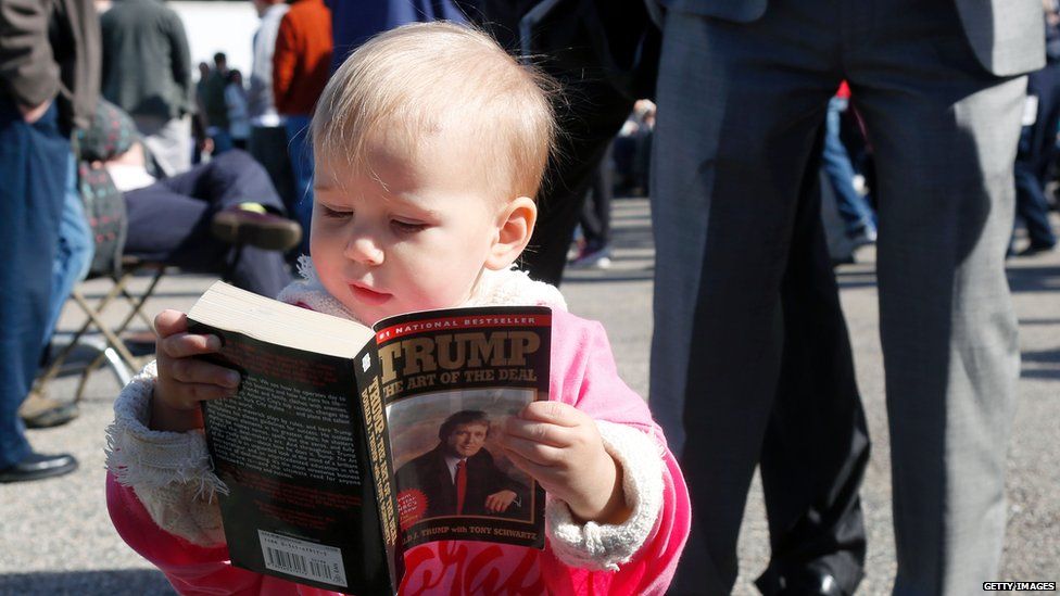 Child reads Art of the Deal