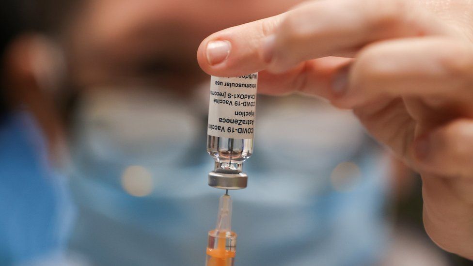 A health worker draws a dose of the AstraZeneca's Covid-19 vaccine