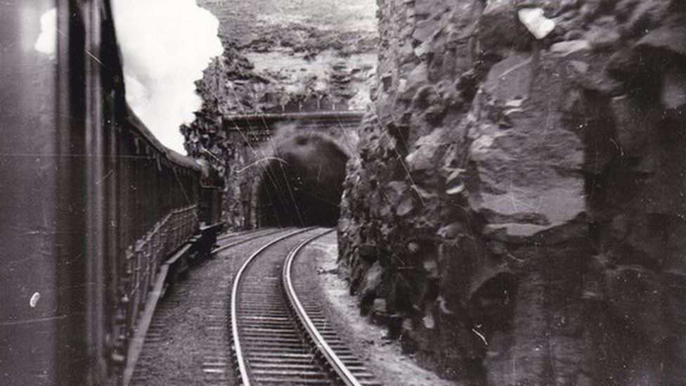 Steam train enters Queensbury Tunnel