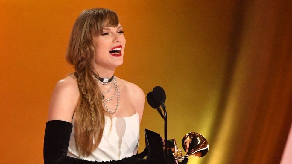 Taylor Swift accepting her Grammy in February 2024.