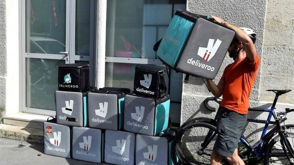 Deliveroo delivery bags and driver
