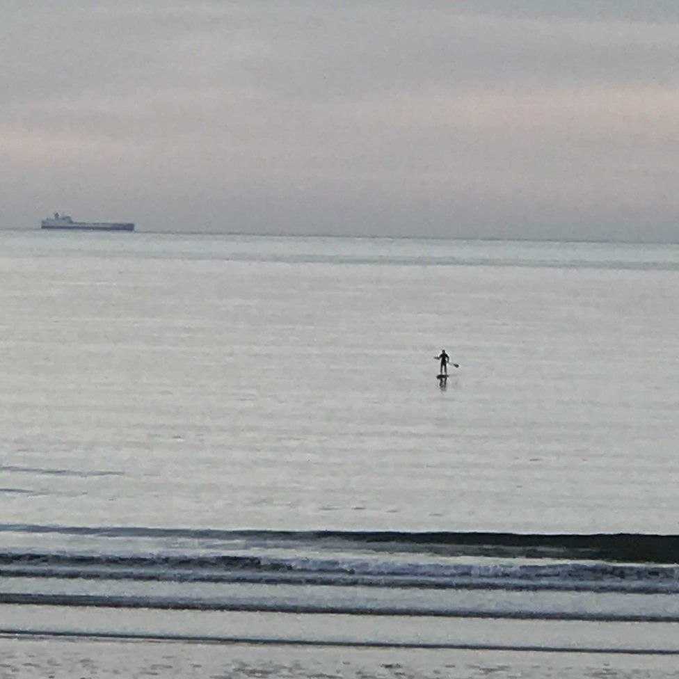 Man on a paddle board in the sea