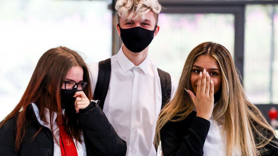 Pupils in a school, some wearing masks