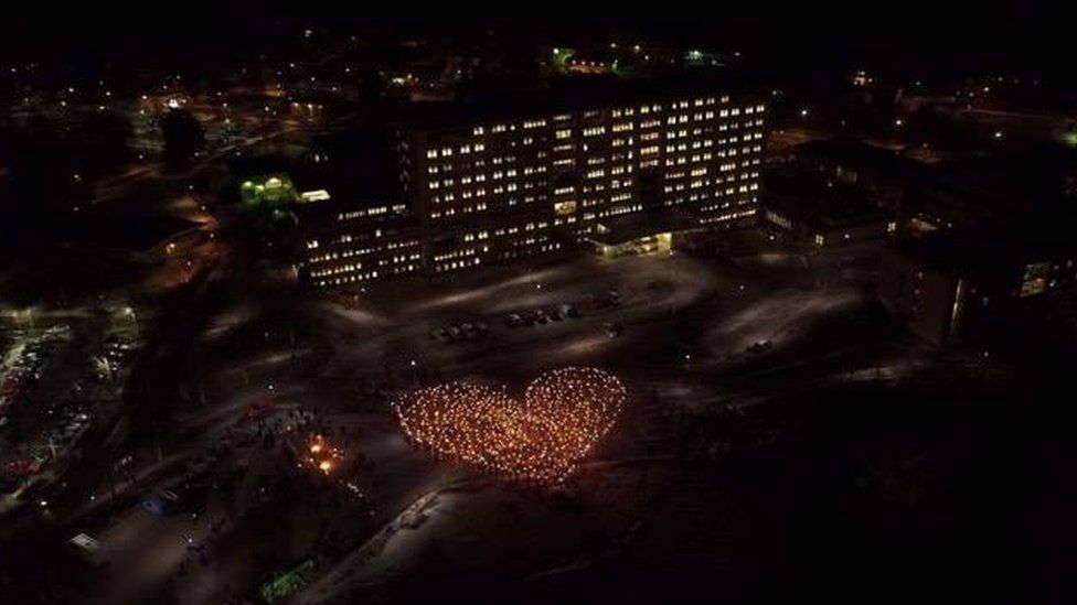 Campaigners for a maternity ward in the Swedish town of Solleftea create a heart out of 1,000 candles outside the hospital on 18 March