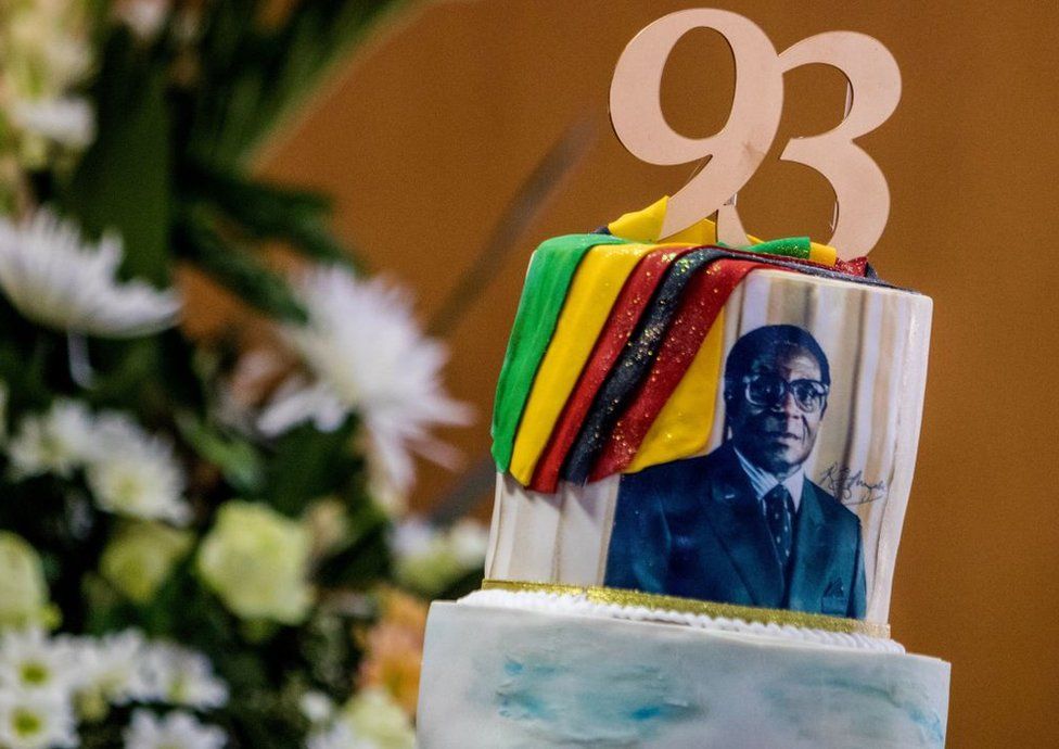 A picture taken on February 21, 2017 shows a cake bearing a portrait of Zimbabwe's President Robert Mugabe during a private ceremony to celebrate Mugabe's 93rd birthday in Harare.
