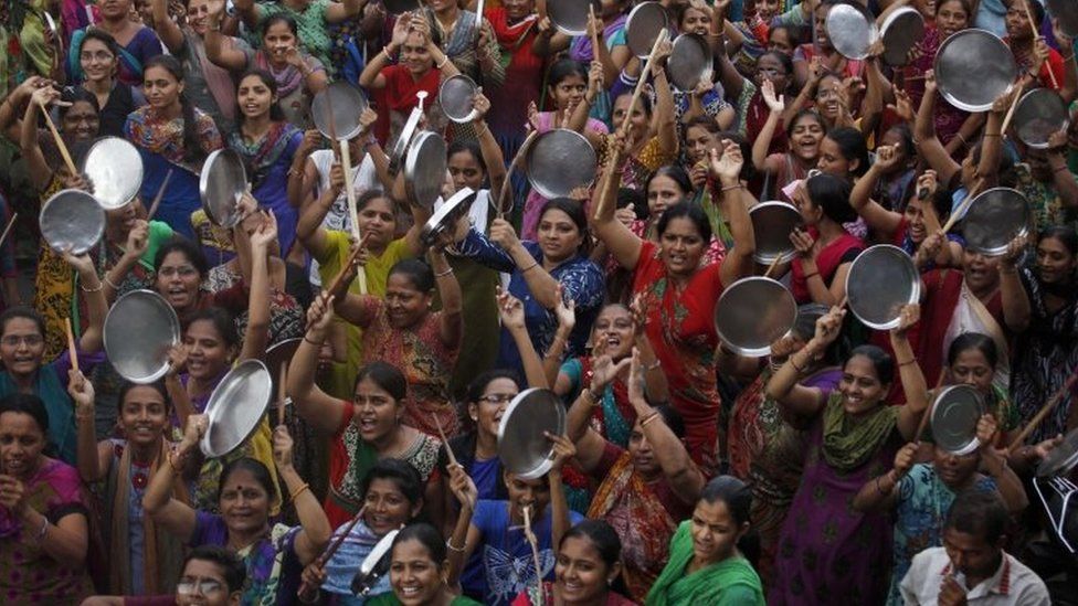 Patel community women beat plates with wooden sticks during a protest after Hardik Patel was detained by police in Surat, in Gujarat in India on September 19, 2015