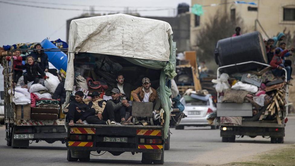 Residents piled into the back of trucks evacuating Rafah, Gaza Strip