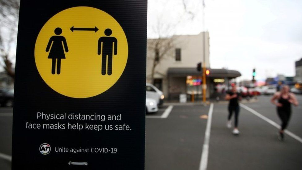 A sign encouraging social distancing is on display in Auckland