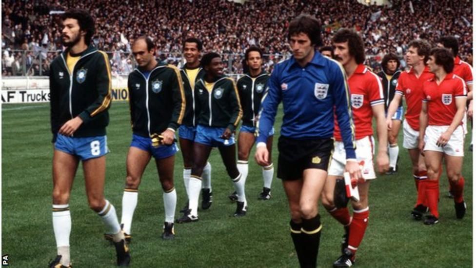 England and Brazil teams walk on to the pitch at Wembley