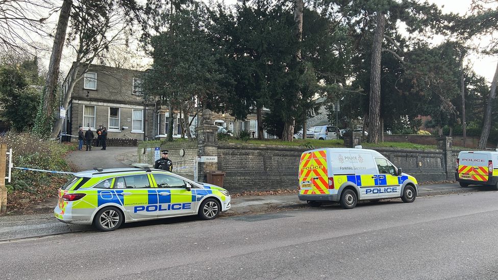 Police cars outside property on Norwich Road