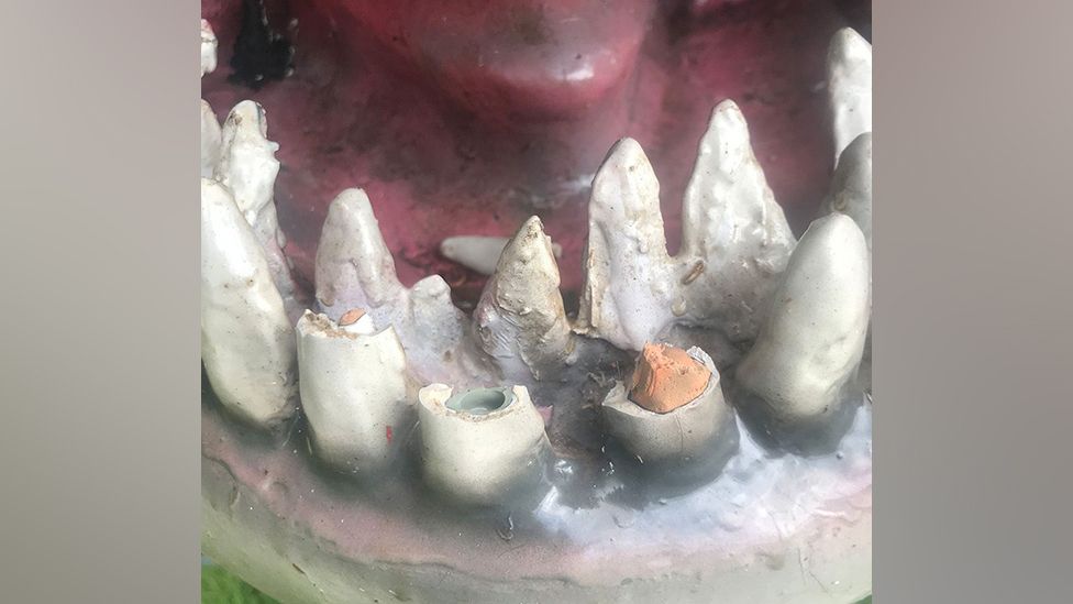 Broken teeth in the mouth of a speedboat that had been built to look like a great white shark