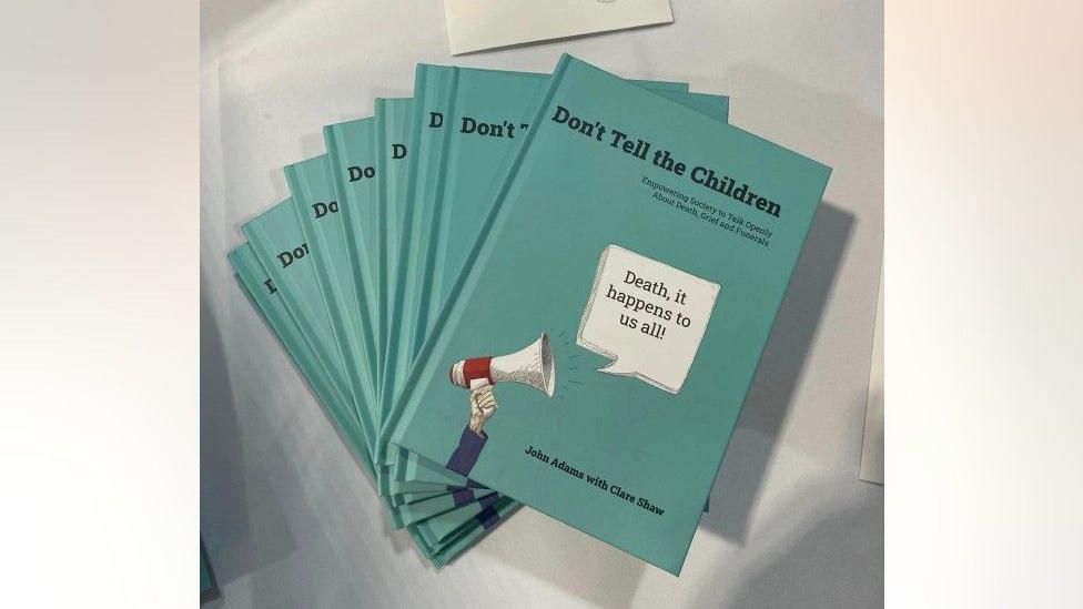 A blue book called Don't Tell the Children