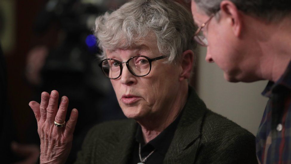Michigan State University (MSU) President Lou Anna Simon answers a question after being confronted by former MSU gymnast Lidsey Lemke d