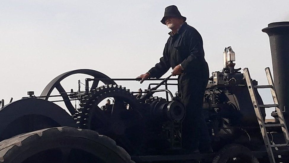 man near a steam engine