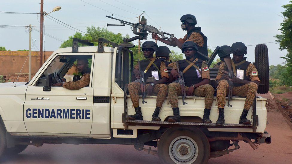 A picture take on October 30, 2018 shows Burkinabe gendarmes sitting on their vehicle in the city of Ouhigouya in the north of Burkina Faso