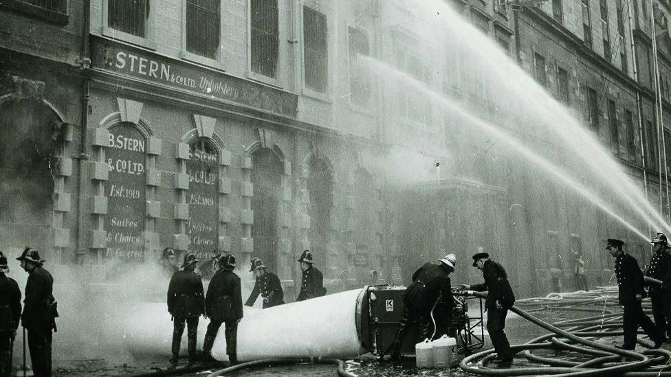 Firefighters battle the fire at the Stern factory