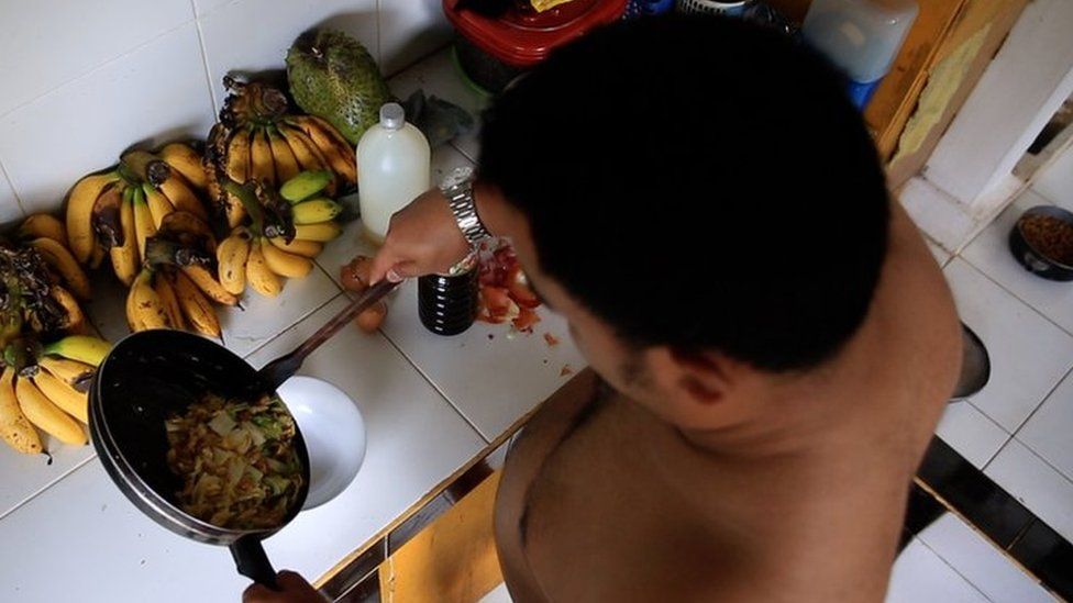 Aditya naked in his kitchen