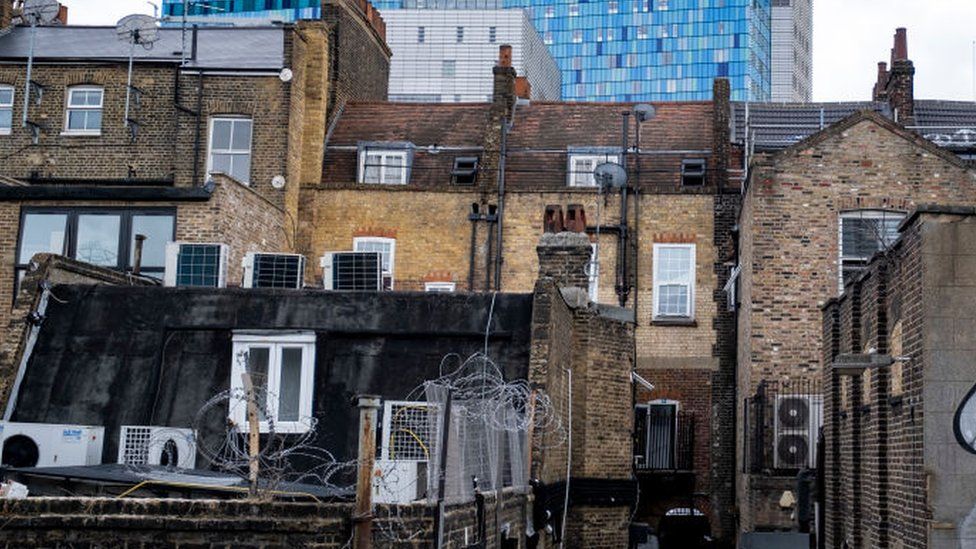 File image of backs of homes and businesses in Whitechapel in east London