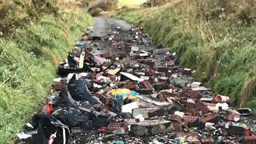 Flytipped rubbish on road