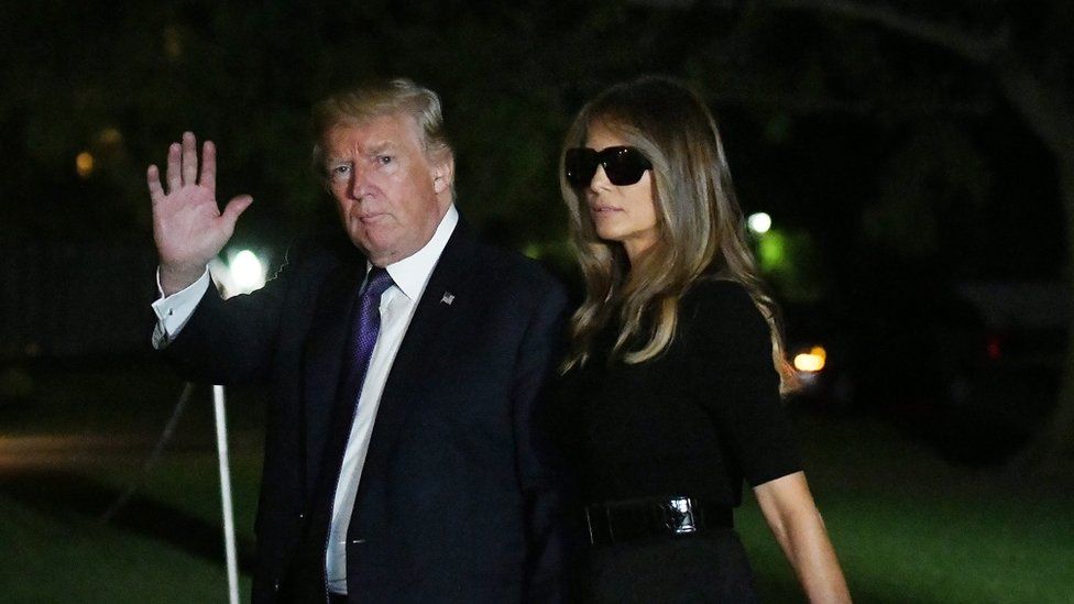 Donald and Melania Trump returning from an official trip