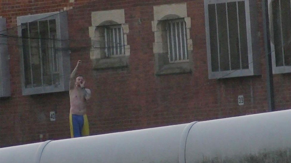 Protester on roof of HMP Manchester