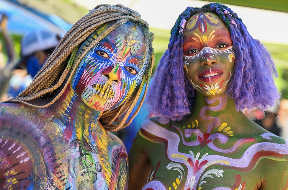 Participants show off artwork at the ninth annual NYC Body Painting Day in Union Square, New York City, US, on 24 July 2022